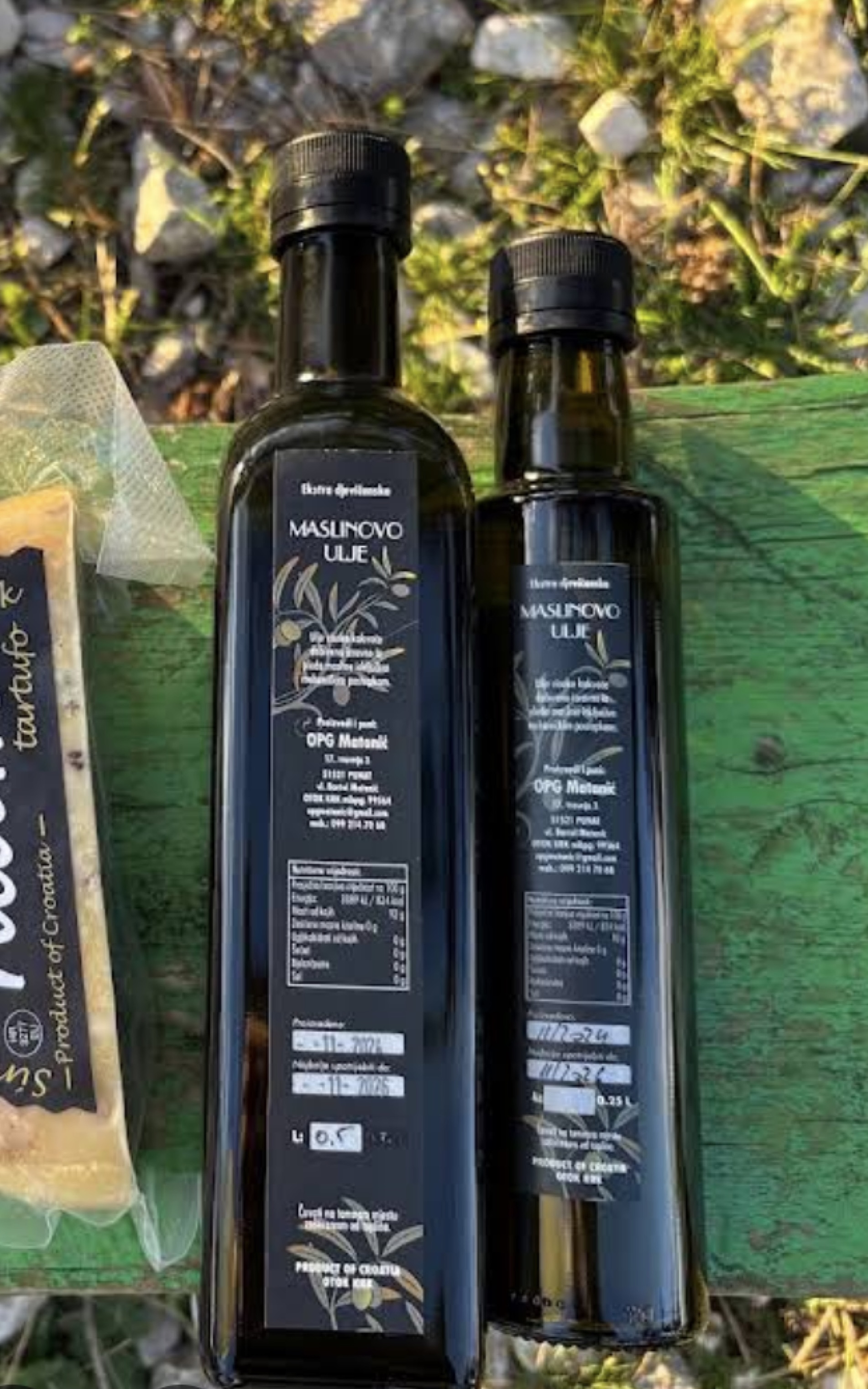 Bottles of Hlam extra virgin olive oil and truffle oil